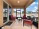 Relaxing screened-in patio with tiled floors, furniture, and views of the private backyard oasis at 3505 Rhapsody St, St Cloud, FL 34772