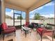 Inviting screened-in patio with comfortable seating, perfect for enjoying the outdoors in style and comfort at 3505 Rhapsody St, St Cloud, FL 34772