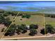 Aerial shot of a large, open parcel of land near the lake, marked by yellow borders at 3650 Lake Tohopekaliga Rd, St Cloud, FL 34772