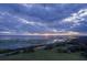 Stunning aerial view of the lake at sunset, showcasing its natural beauty at 3650 Lake Tohopekaliga Rd, St Cloud, FL 34772