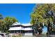 Two-story home with classic architecture and mature trees at 3650 Lake Tohopekaliga Rd, St Cloud, FL 34772