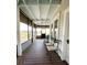 Inviting screened porch with seating, offering a relaxing outdoor space and view of the yard at 3650 Lake Tohopekaliga Rd, St Cloud, FL 34772