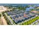 Aerial community view featuring modern homes nestled amongst lush greenery and serene lakes, highlighted with a home pin at 4233 Mistwood St, Winter Garden, FL 34787
