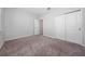 Bedroom featuring plush carpet and a double door closet for optimal storage space at 4233 Mistwood St, Winter Garden, FL 34787