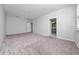 Spacious bedroom featuring plush carpet and a doorway leading to the ensuite bathroom at 4233 Mistwood St, Winter Garden, FL 34787