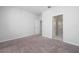 Minimalist bedroom featuring neutral carpet and white walls, offering a blank canvas for personalization at 4233 Mistwood St, Winter Garden, FL 34787
