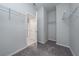 Spacious walk-in closet with wire shelving; open door to hallway, showing convenience and organization at 4233 Mistwood St, Winter Garden, FL 34787
