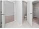 Hallway view showing access to bedroom, bathroom, and walk-in closet at 4233 Mistwood St, Winter Garden, FL 34787