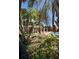 Lush landscaping surrounds a community poolside pavilion with ample seating and shade for residents at 4233 Mistwood St, Winter Garden, FL 34787