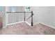 Close up of staircase with plush carpeting and a decorative white spindle railing at 4233 Mistwood St, Winter Garden, FL 34787