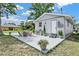 Backyard featuring a patio with an outdoor kitchen and dining area with table and chairs at 4510 Douglas St, Sanford, FL 32771