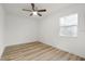 An empty bedroom showing wood grain flooring at 4510 Douglas St, Sanford, FL 32771