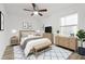 Bright bedroom with a ceiling fan, neutral decor, wood-look floors, and lots of natural light create a relaxing retreat at 4510 Douglas St, Sanford, FL 32771