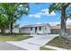 Inviting single-story house with a spacious driveway and manicured lawn at 4510 Douglas St, Sanford, FL 32771