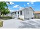 Welcoming one-story home with a tidy front yard and a side storage shed at 4510 Douglas St, Sanford, FL 32771