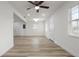 Bright living area with wood-look floors and a white interior provides a clean and spacious atmosphere at 4510 Douglas St, Sanford, FL 32771