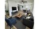 Comfortable living room with a modern color palette and wood-look flooring creates a stylish and inviting space at 4510 Douglas St, Sanford, FL 32771