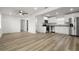 Open-concept living space featuring modern appliances and new flooring at 4510 Douglas St, Sanford, FL 32771