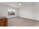 Spacious bedroom features a ceiling fan, window and neutral carpeting at 4897 Cypress Woods Dr # 6314, Orlando, FL 32811