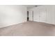 Spacious, carpeted bedroom features a ceiling light and access to storage at 4897 Cypress Woods Dr # 6314, Orlando, FL 32811