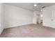 Large bedroom with ceiling fan and neutral carpet at 4897 Cypress Woods Dr # 6314, Orlando, FL 32811
