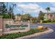 Welcoming SummerGate Condominiums sign with manicured landscaping and a glimpse of the community at 4897 Cypress Woods Dr # 6314, Orlando, FL 32811