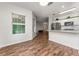 Open-concept kitchen with stainless appliances, granite counters, and an eat-in bar at 4897 Cypress Woods Dr # 6314, Orlando, FL 32811