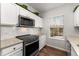 Kitchen with stainless steel appliances, white cabinets, subway tile backsplash, and granite countertops at 4897 Cypress Woods Dr # 6314, Orlando, FL 32811