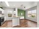 Open concept kitchen with island, stainless steel appliances and view into the dining space at 4897 Cypress Woods Dr # 6314, Orlando, FL 32811