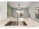 Kitchen featuring stainless steel sink with granite countertops and a view from the windows at 4897 Cypress Woods Dr # 6314, Orlando, FL 32811