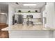 Well-appointed kitchen featuring stainless steel appliances, granite counters, and white cabinetry at 4897 Cypress Woods Dr # 6314, Orlando, FL 32811