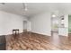 Large living room with modern flooring, and a view of the kitchen area with stainless steel appliances at 4897 Cypress Woods Dr # 6314, Orlando, FL 32811