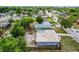 Overhead view of a single Gathering home with a fenced-in yard surrounded by mature trees and neighboring houses at 4908 Keith Pl, Orlando, FL 32808