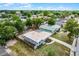 Aerial view of a single Gathering home with a fenced-in yard surrounded by mature trees in a residential neighborhood at 4908 Keith Pl, Orlando, FL 32808