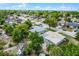 Aerial view showcasing property, nearby streets, and lush surrounding foliage at 4908 Keith Pl, Orlando, FL 32808