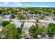 Aerial image of a single Gathering house with mature trees in a neighborhood setting outlined in red at 4908 Keith Pl, Orlando, FL 32808