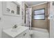 Updated bathroom with a shower-tub combination, modern fixtures, and stylish vanity at 4908 Keith Pl, Orlando, FL 32808