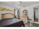 Comfortable bedroom featuring wood-look flooring, a cozy bed, and ample closet space at 4908 Keith Pl, Orlando, FL 32808