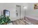 Cozy bedroom features a view of the lake, wood-look flooring, and a warm ambiance at 4908 Keith Pl, Orlando, FL 32808