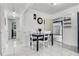Dining room with tile flooring, view to the hallway, and access to the garage at 4908 Keith Pl, Orlando, FL 32808