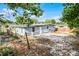 Exterior angle of the house featuring tidy yard and simple siding at 4908 Keith Pl, Orlando, FL 32808