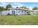 Charming single-story home with a covered carport, tidy lawn and fresh landscaping at 4908 Keith Pl, Orlando, FL 32808