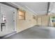 Inside the garage showing concrete floors, and two windows for natural light at 4908 Keith Pl, Orlando, FL 32808