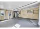 Inside the garage showing concrete floors and access to the kitchen and the backyard at 4908 Keith Pl, Orlando, FL 32808