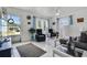 Comfortable living room with tile flooring, a large window, and neutral decor at 4908 Keith Pl, Orlando, FL 32808