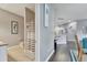 A well lit bathroom includes a tub, a shower, and a patterned shower curtain at 505 Terrace Ridge Cir # 505, Davenport, FL 33896