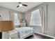 This bedroom features two windows, light walls, and a ceiling fan at 505 Terrace Ridge Cir # 505, Davenport, FL 33896