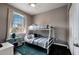 This bedroom features a bunk bed, ceiling fan, and an exterior view at 505 Terrace Ridge Cir # 505, Davenport, FL 33896