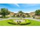 Inviting community building with lush landscaping, a fountain, and convenient parking for residents and guests at 505 Terrace Ridge Cir # 505, Davenport, FL 33896