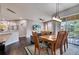 Bright dining room with views of the balcony and the outdoors, with seating for six at 505 Terrace Ridge Cir # 505, Davenport, FL 33896